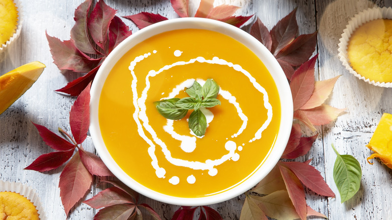 creamy pumpkin bisque with fresh basil and corn muffins