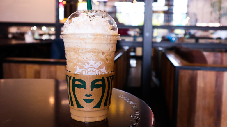 large frappuccino sitting on store table