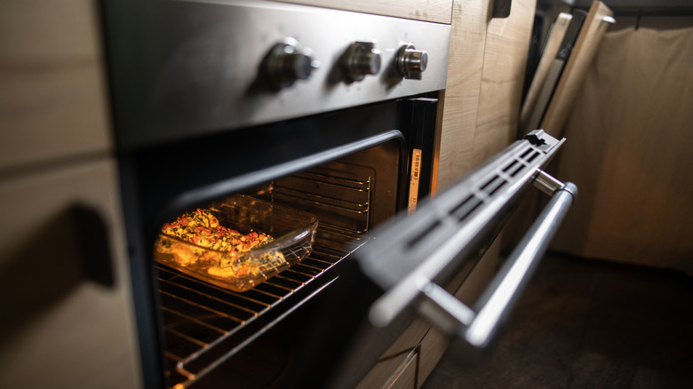 oven door open with dish inside