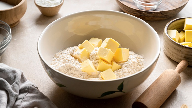 Bowl of flour with butter cubes