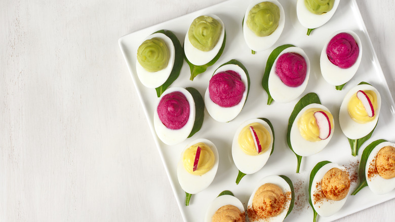 Tray of deviled eggs with different fillings