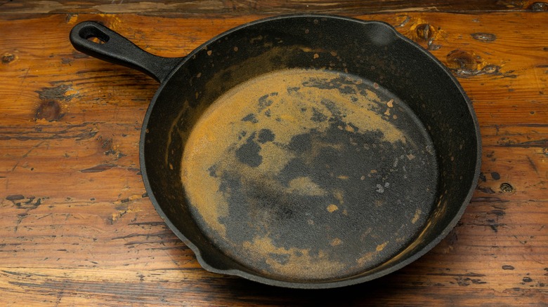 A rusted cast iron skillet