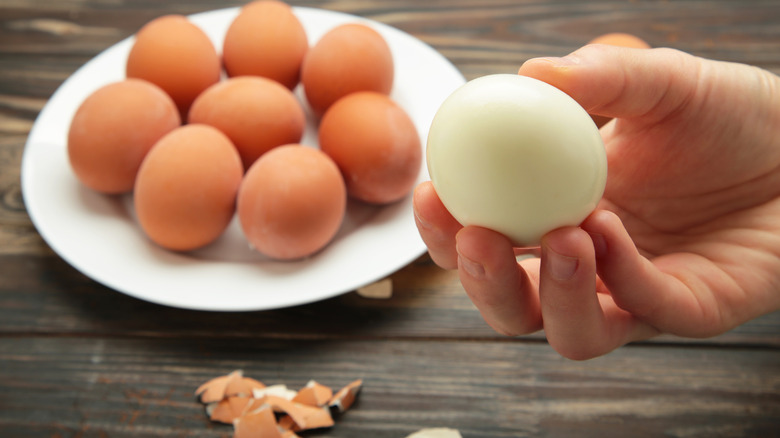 peeled egg with left over shell