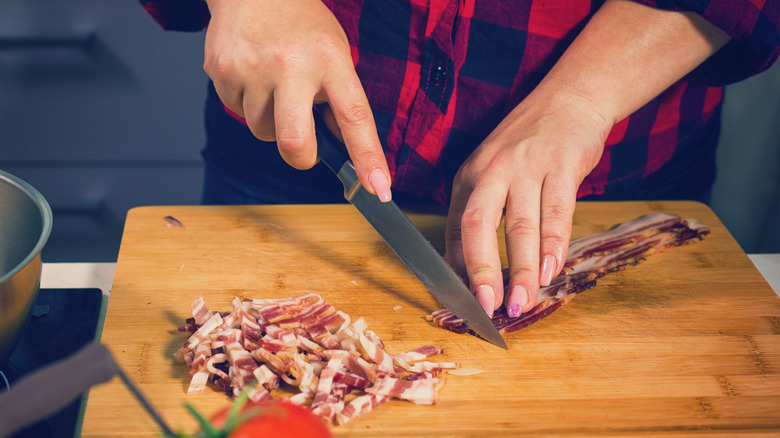 woman slicing bacon