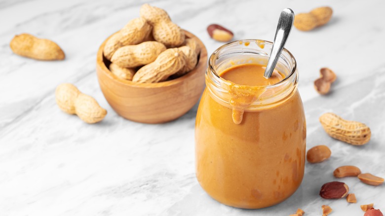 Natural peanut butter in glass jar