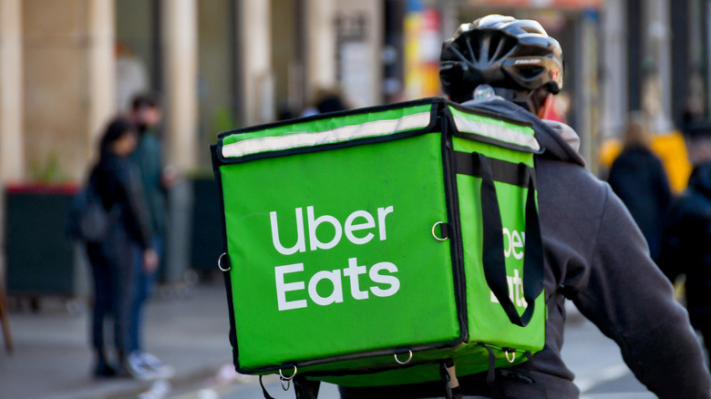 Delivery cyclist with Uber Eats bag