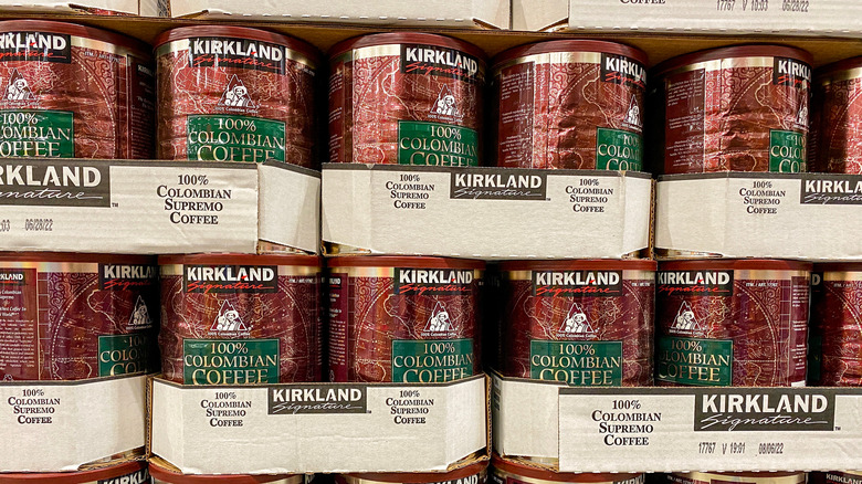 Tins of Kirkland Signature brand Colombian coffee stacked in cardboard packaging