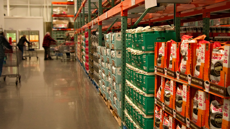 A coffee aisle at Costco with various coffee brands displayed