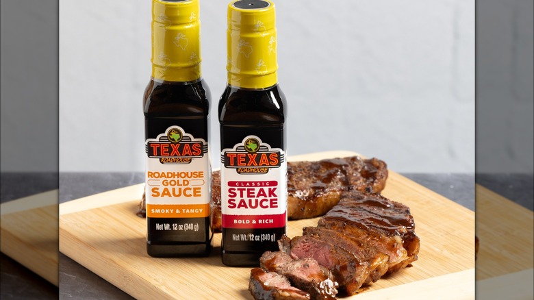 Texas Roadhouse steak sauces pictured with steak