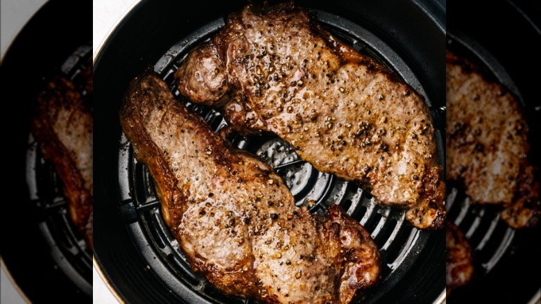 steaks cooking in air fryer