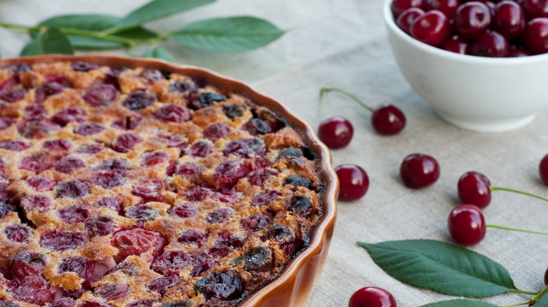 Freshly baked sour cherry cobbler on printed tablecloth