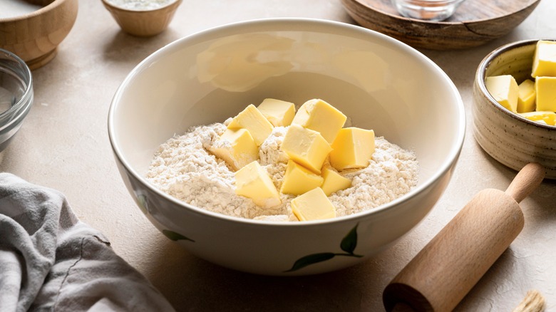 Cubes of butter in a bowl of flour