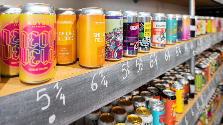 Colorful craft beer cans on store shelves