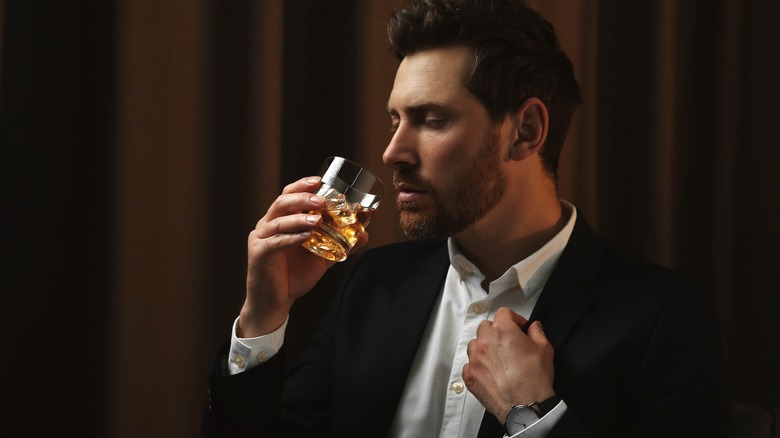 man nosing a bourbon whiskey