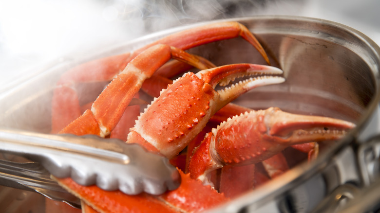 Crab legs cooking in pot