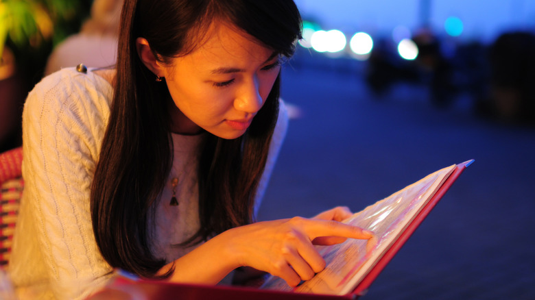 Woman reading menu