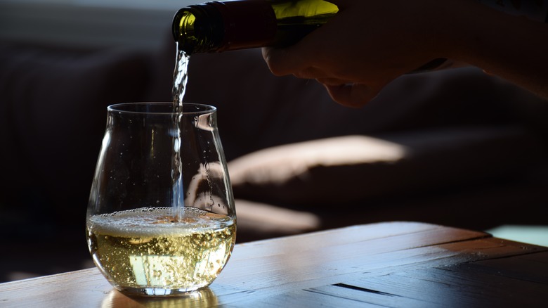 Pouring a glass of white wine