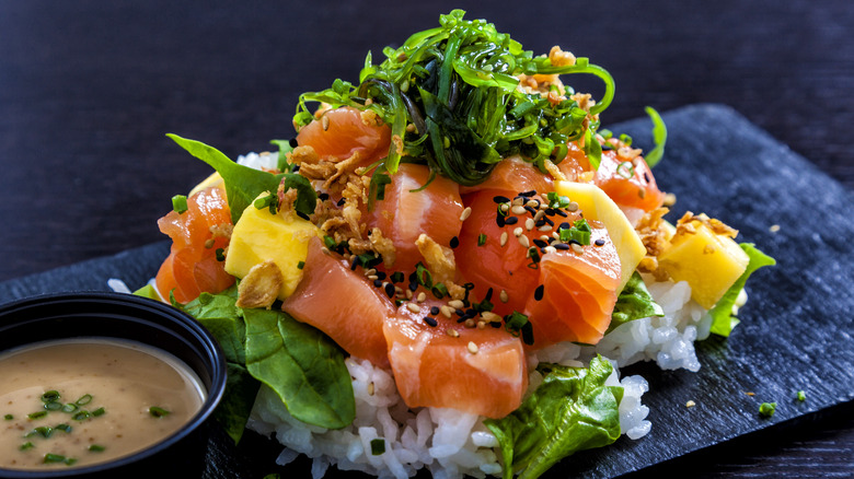 salad with raw salmon over rice