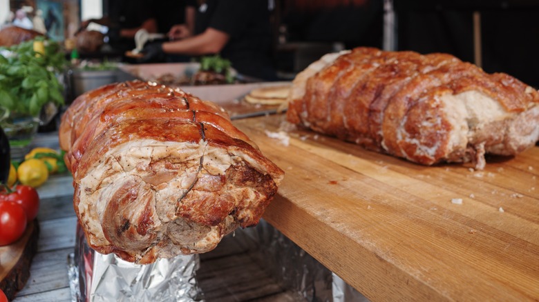 porchetta resting on a cutting board