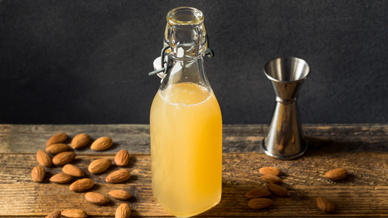 Orgeat syrup with jigger and almonds