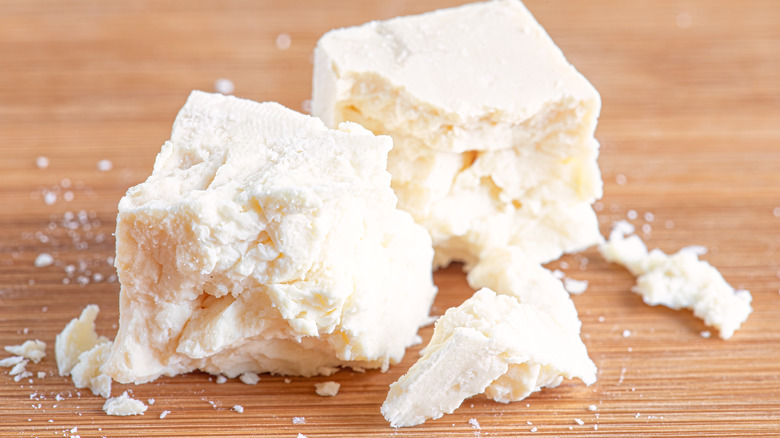 Feta cheese on a wooden surface