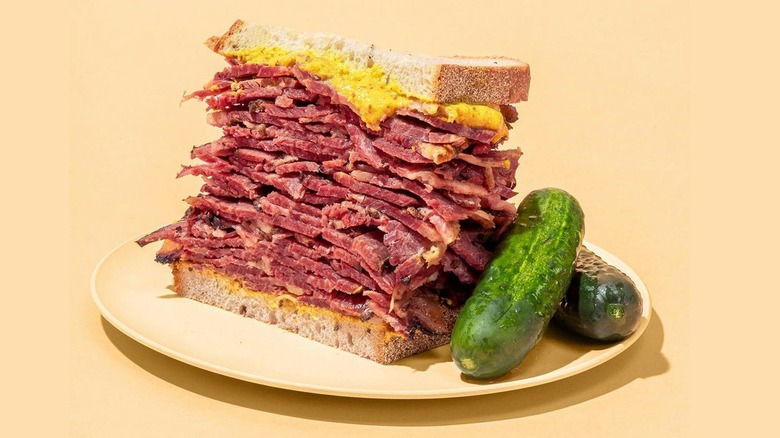 Pastrami Queen's pastrami sandwich on rye with pickle spears