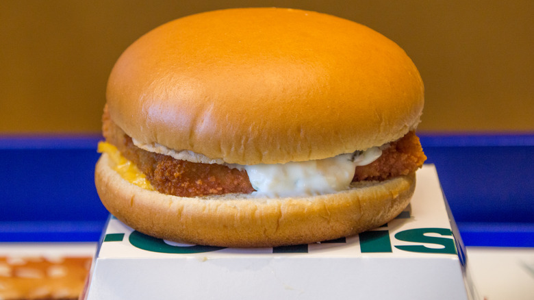 McDonald's Filet-O-Fish sandwich sits on top of serving box