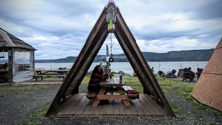 A wooden shelter at Hama Hama, designed to keep the wind at bay as diners enjoy oysters along the Hood Canal