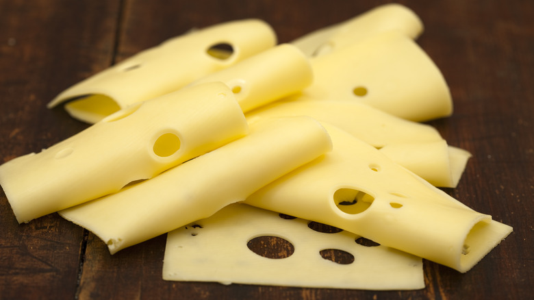 Swiss cheese with iconic holes