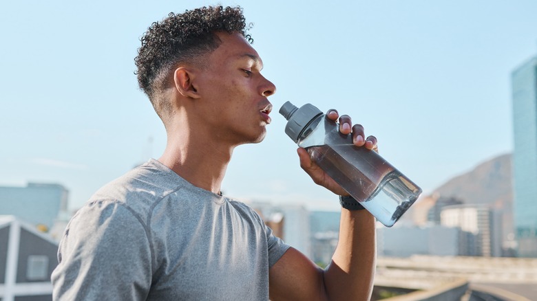 Athlete drinking water