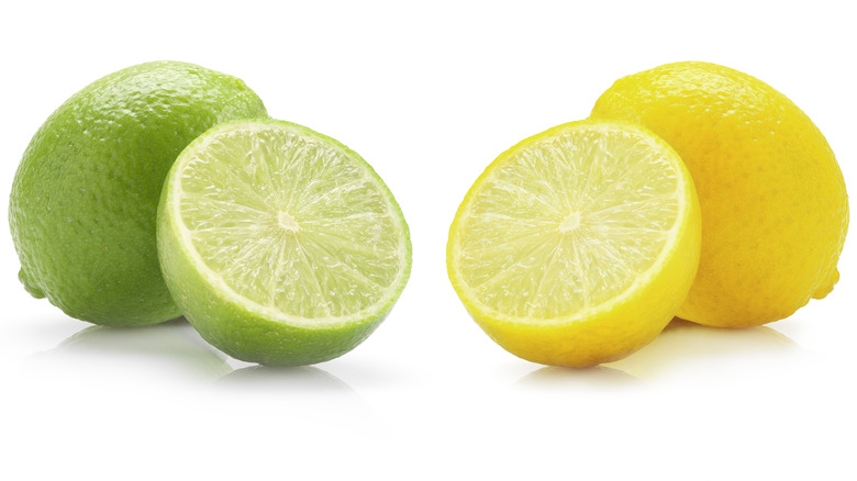 Whole and halved limes and lemons