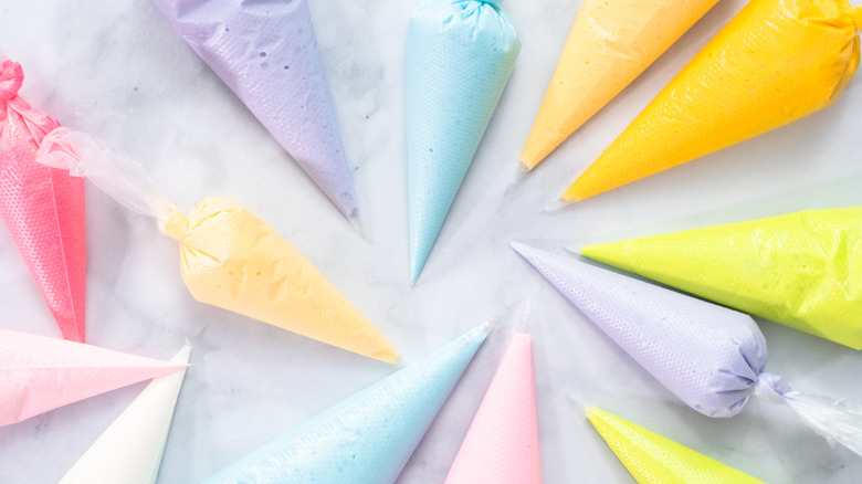 Different colors of royal icing in piping bags