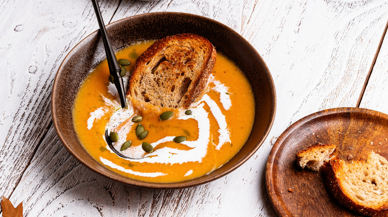 Bowls of vegan butternut squash soup with toast