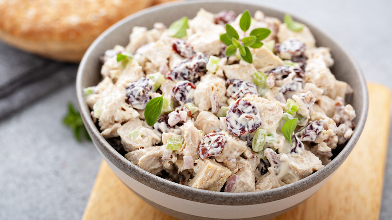 Bowl of chicken salad with cherries and celery
