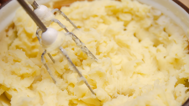 beating mashed potatoes with mixer