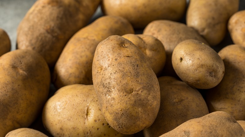 Raw Russet potatoes in a pile