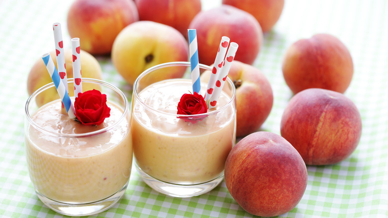 Peach smoothie garnished with rose