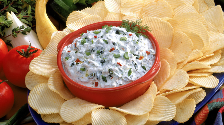 creamy dip surrounded by potato chips
