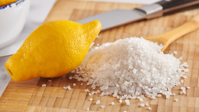 Lemon and salt on a cutting board