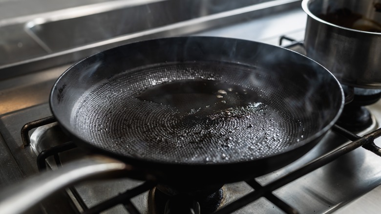 A pan heating on a stove