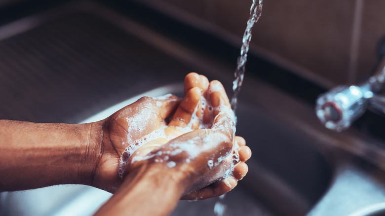close up on hands being washed