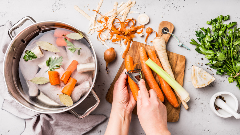 a cook preparing chicken broth