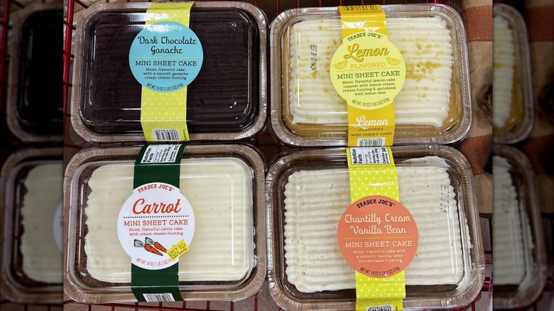 Four mini sheet cakes, dark chocolate, lemon, carrot, and chantilly vanilla bean, are all sat in a grocery cart