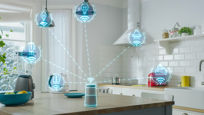 smart device on kitchen counter controlling other devices