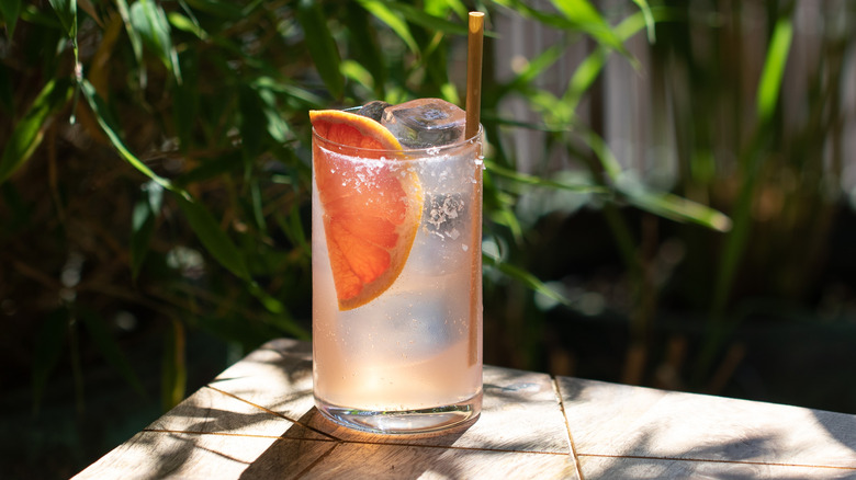 A paloma cocktail made with clear ice.