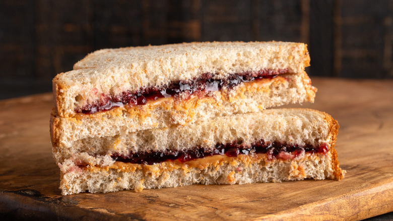 Diagonally cut peanut butter and grape jelly sandwich with the halves on top of each other and cut sides facing forward