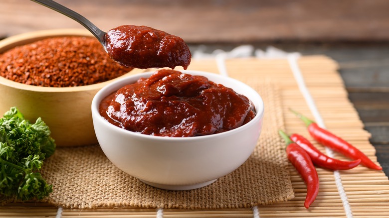 Korean gochujang red chili paste in a bowl with spoon