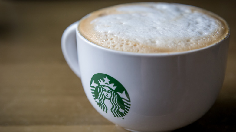 Starbucks branded mug with cappucino