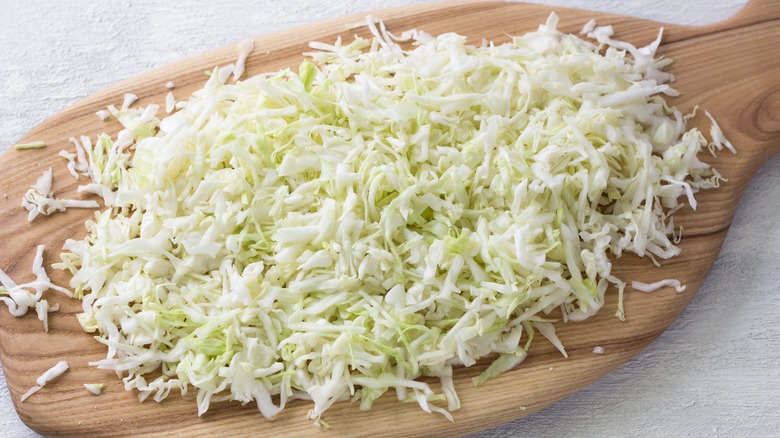 Shredded cabbage on cutting board