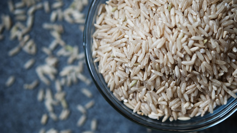 a bowl of uncooked brown rice